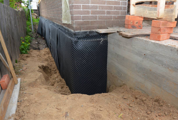 Happy homeowners after waterproofing job in Conyers